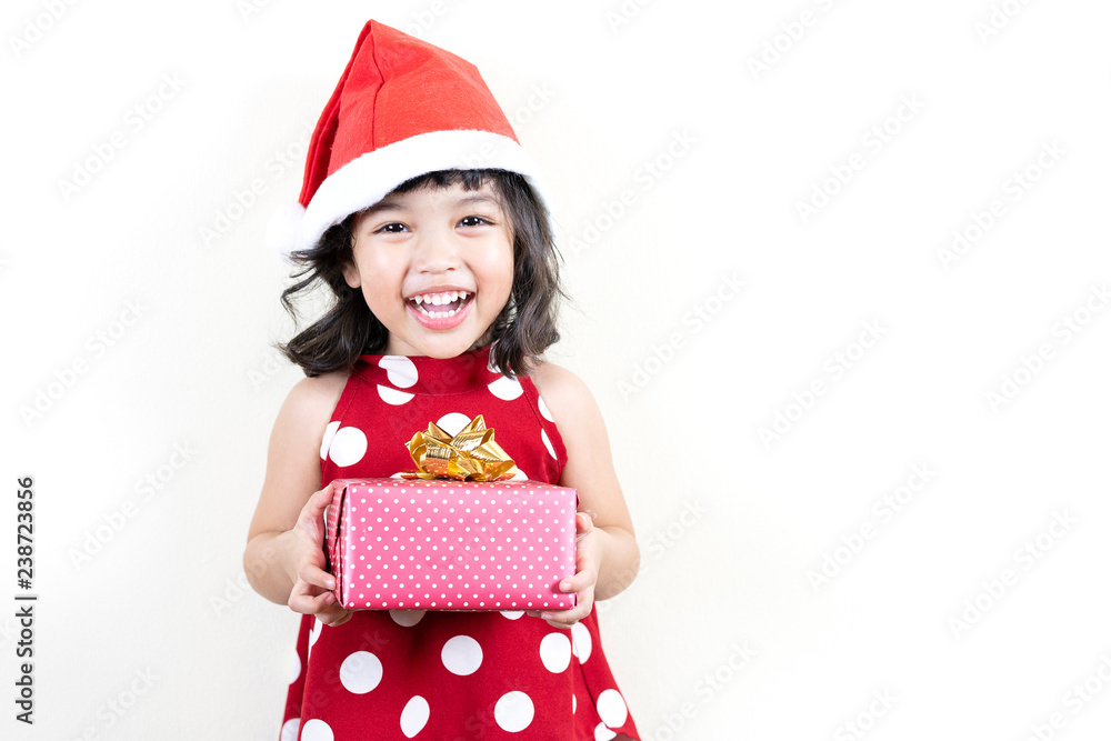 Happy Asian little smiling girl with christmas gift box. new year celebration concept. Happy Asian little smiling girl with christmas gift box. new year celebration concept.
