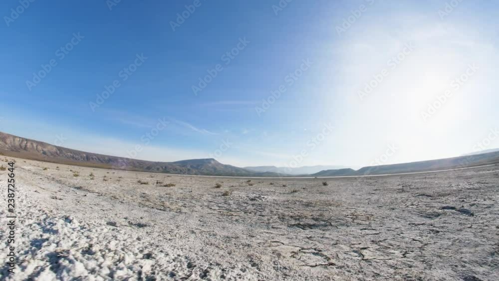 movement on a desert land with a curved horizon and blue sky movement on a desert land with a curved horizon and blue sky