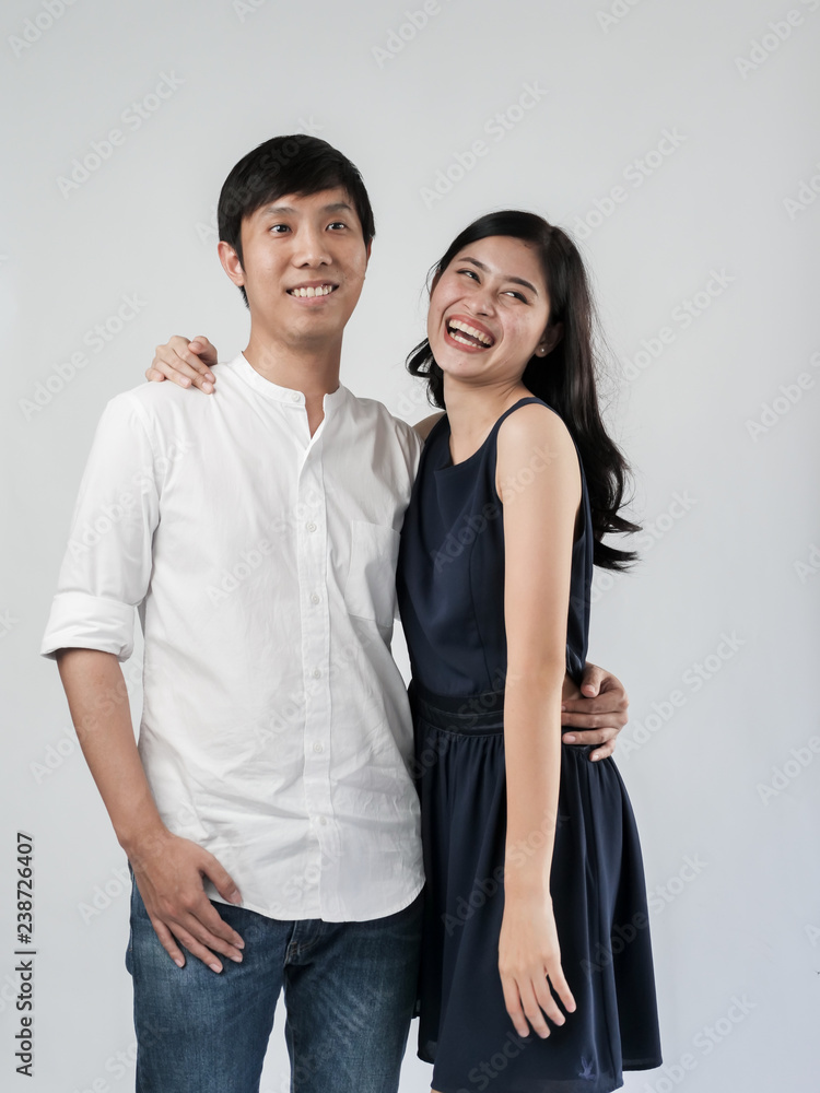 Asian couple hugging together with white background. Asian couple hugging together with white background.