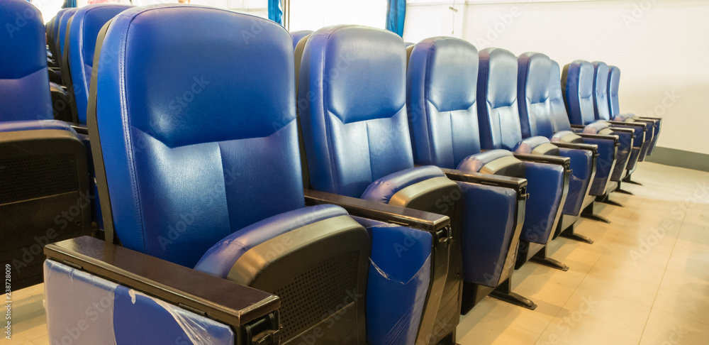 Fototapeta premium Row Chair Blue at cinema theater in the afternoon is sunset light