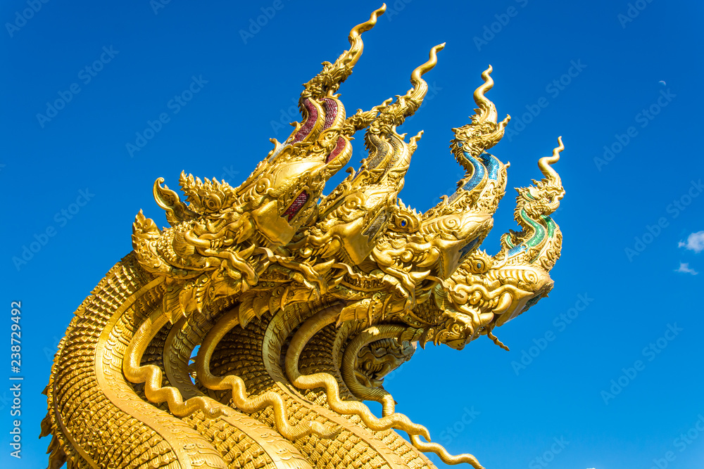 Golden Naga Statue with background sky Golden Naga Statue with background sky