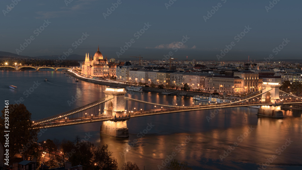 Panorama of the Hungarian Parliament, and the Chain bridge (Szechenyi Lanchid), over the River Danube, Budapest, Hungary, at night
