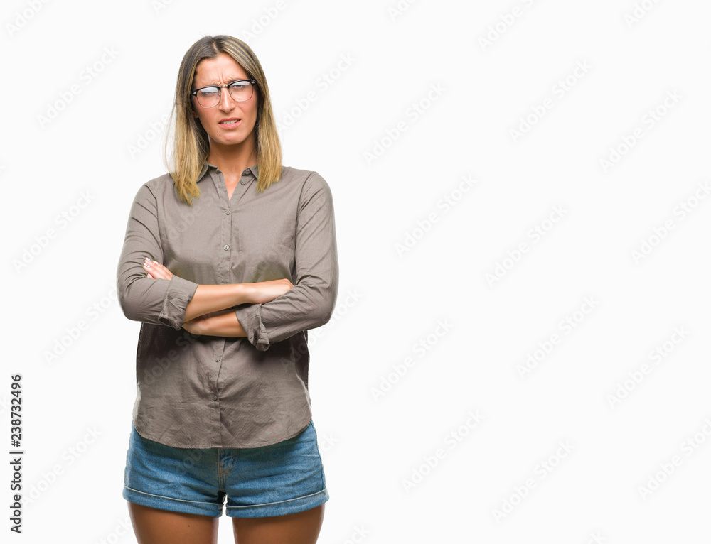 Young beautiful woman over isolated background skeptic and nervous, disapproving expression on face with crossed arms. Negative person. Young beautiful woman over isolated background skeptic and nervous, disapproving expression on face with crossed arms. Negative person.