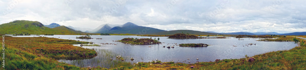 Scottish landscapes: Panoramic view of Loch Lomond and The Trossachs National Park with Ben More in the distance. Scottish landscapes: Panoramic view of Loch Lomond and The Trossachs National Park with Ben More in the distance.