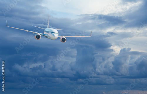 Passenger airplane in the clouds - Travel by air transport
