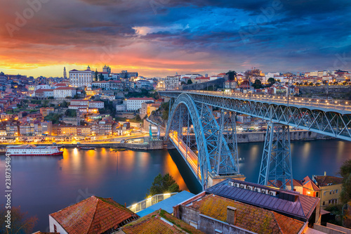 Porto, Portugal. Cityscape image of Porto, Portugal with the famous Luis I Bridge and the Douro River during dramatic sunset. photo