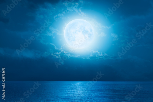 Night sky with moon in the clouds "Elements of this image furnished by NASA