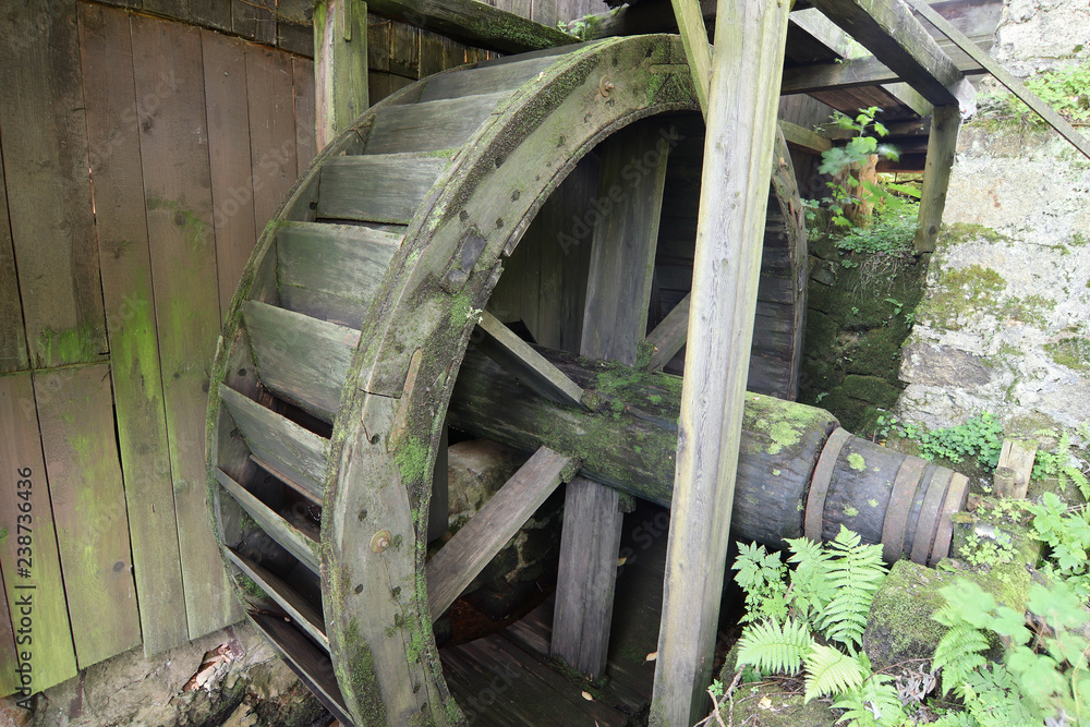 Old big water wheel of the historic mill saw