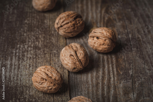 close up view of walnuts on wooden surface