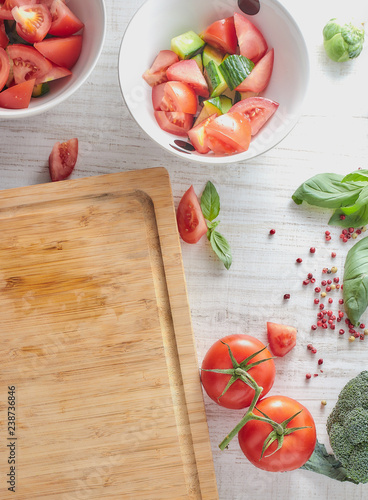 cooking vegetables salad in the kitchen. healthy food. vegetarian diet. close-up. chopping board with a set of fresh vegetables.