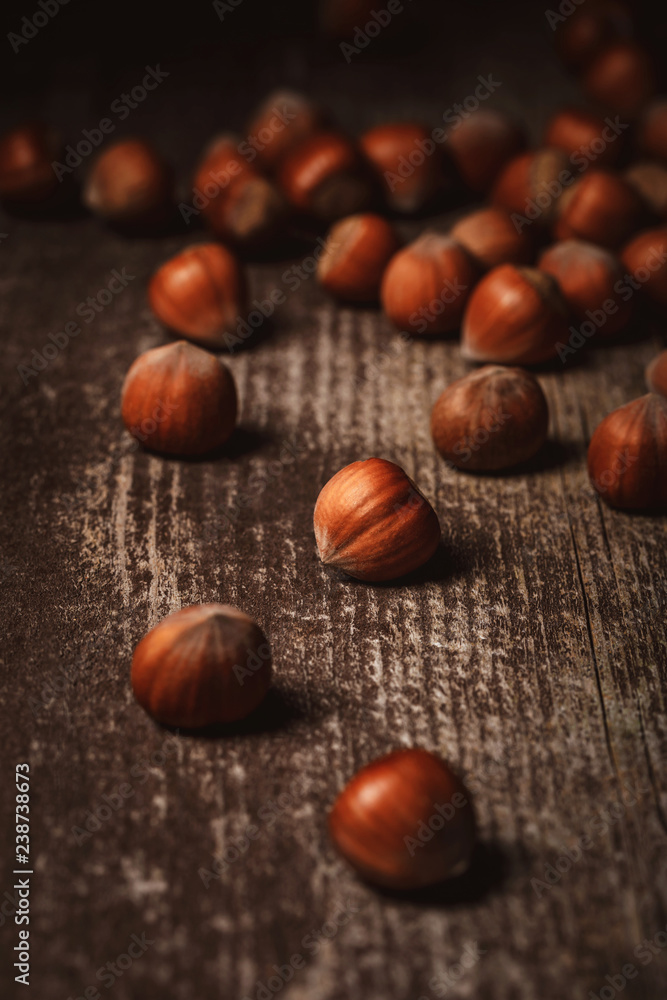 close up view of shelled hazelnuts on wooden tabletop close up view of shelled hazelnuts on wooden tabletop