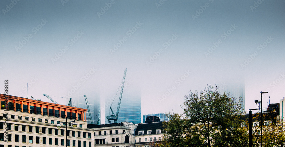 Blanket of fog obscures the skyline of the city of London, UK