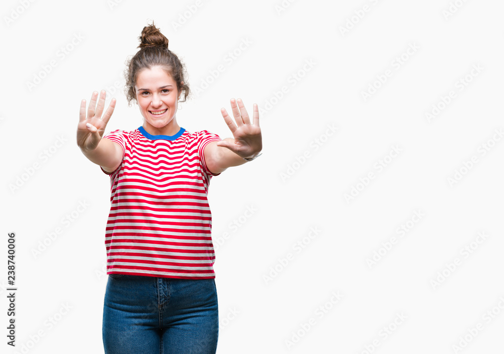 Beautiful brunette curly hair young girl wearing casual look over isolated background showing and pointing up with fingers number nine while smiling confident and happy. Beautiful brunette curly hair young girl wearing casual look over isolated background showing and pointing up with fingers number nine while smiling confident and happy.