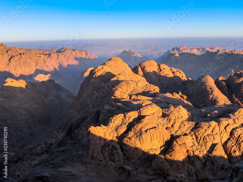 Spectacular aerial view of the holy summit of Mount Sinai, Aka Jebel Musa, 2285 meters, at sunrise, Sinai Peninsula in Egypt. Spirituality, religion and history concept. © bennymarty