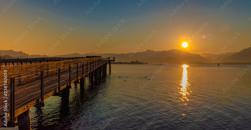 Stunning sunset on the shores of the Upper Zurich Lake near Rapperswil, Switzerland