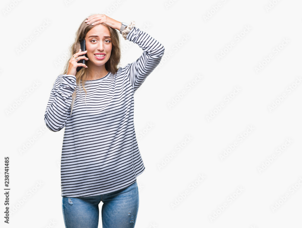 Beautiful young blonde woman talking on smarpthone over isolated background stressed with hand on head, shocked with shame and surprise face, angry and frustrated. Fear and upset for mistake. Beautiful young blonde woman talking on smarpthone over isolated background stressed with hand on head, shocked with shame and surprise face, angry and frustrated. Fear and upset for mistake.