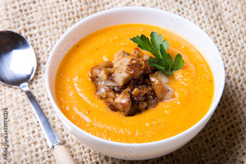 Pumpkin soup with porcini mushrooms. Selective focus, close-up.