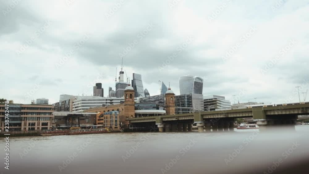Beautiful Panorama Of The City In England. Old Buildings On The Background Of Modern Skyscrapers. View Of The Bridge At An Angle. Beautiful Panorama Of The City In England. Old Buildings On The Background Of Modern Skyscrapers. View Of The Bridge At An Angle.