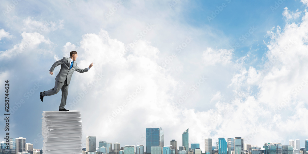 Precise businessman in suit running with phone. Precise businessman in suit running with phone.