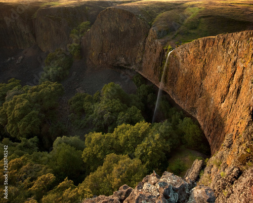 Large waterfall over giant cliff at sunset: Phantom Falls, California