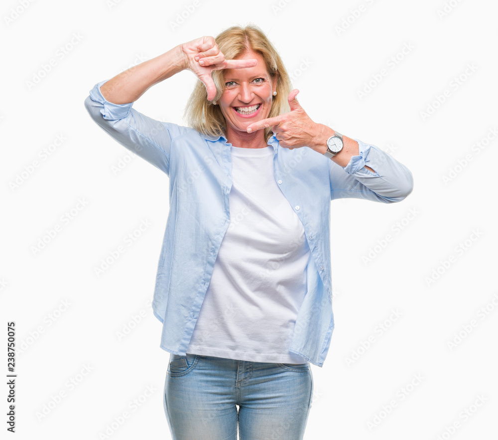 Middle age blonde woman over isolated background smiling making frame with hands and fingers with happy face. Creativity and photography concept.