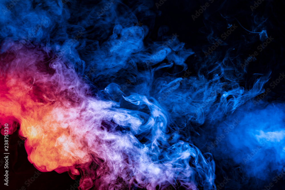 The beautiful color combination of blue, orange, violet and red hues from  the substance is smoke, on a black background resembling the Milky Way.  Stock Photo | Adobe Stock