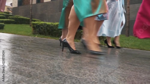 Beautiful girls in fashion dresses defile on the street. Plus size Fashion Week. Slow motion. photo