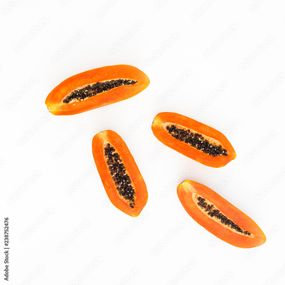 Slice of sweet papaya on white background. Flat lay. Top view. Fruit concept Slice of sweet papaya on white background. Flat lay. Top view. Fruit concept