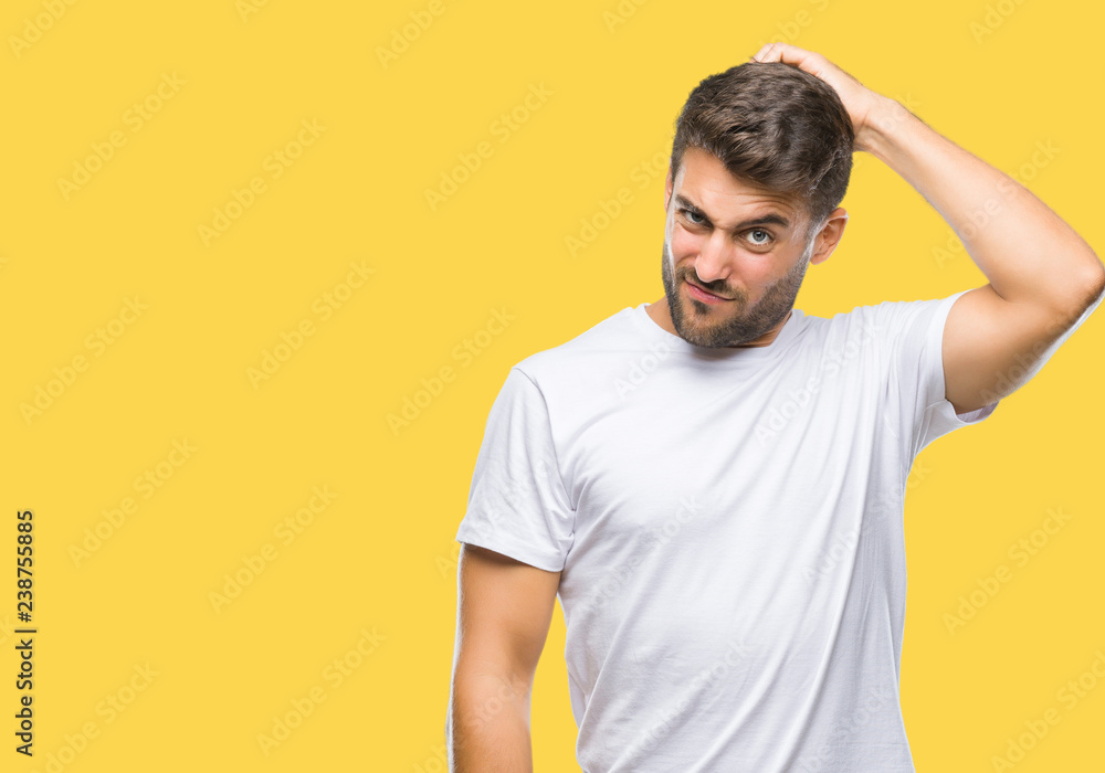 Young handsome man over isolated background confuse and wonder about question. Uncertain with doubt, thinking with hand on head. Pensive concept. Young handsome man over isolated background confuse and wonder about question. Uncertain with doubt, thinking with hand on head. Pensive concept.