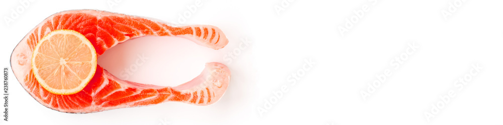 Fresh Sea Salmon Fish Steak trend toned Living coral color with slice of yellow lemon isolated on white background with white background. Top view. Flat lay. Header for fish site. Fresh Sea Salmon Fish Steak trend toned Living coral color with slice of yellow lemon isolated on white background with white background. Top view. Flat lay. Header for fish site.