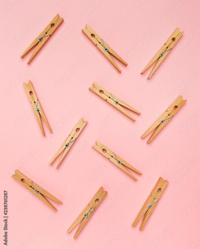 Clothes pins on a pink background Clothes pins on a pink background