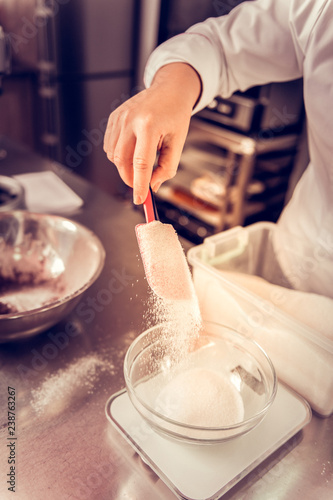 Top view of a spatula with sugar on it