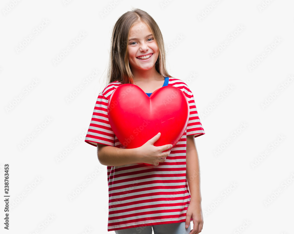 Young beautiful girl holding red heart over isolated background with a happy face standing and smiling with a confident smile showing teeth Young beautiful girl holding red heart over isolated background with a happy face standing and smiling with a confident smile showing teeth