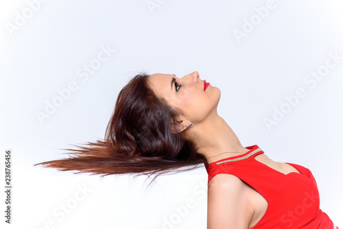 Studio portrait of a young pretty woman on a white background