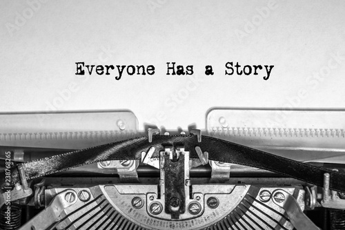 Obraz na plátně Everyone Has a Story printed on a sheet of paper on a vintage typewriter