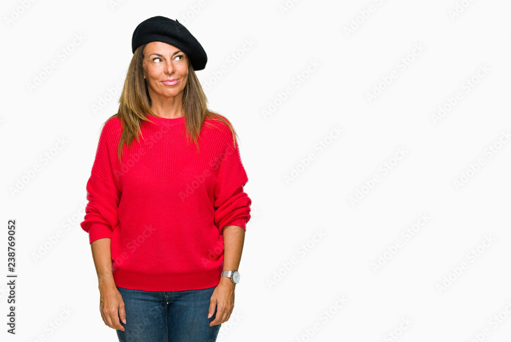 Middle age adult woman wearing fashion beret over isolated background smiling looking side and staring away thinking. Middle age adult woman wearing fashion beret over isolated background smiling looking side and staring away thinking.
