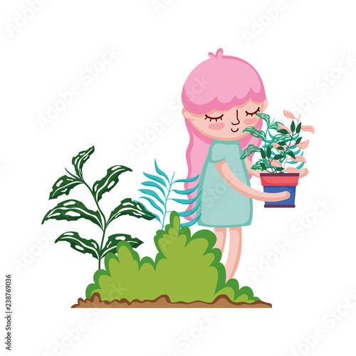 little girl lifting houseplant in the camp