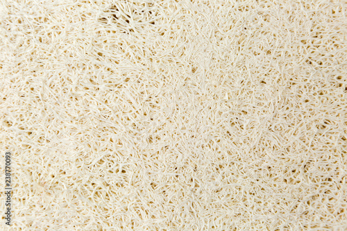 Фотография Bath luffa washing sponge texture closeup