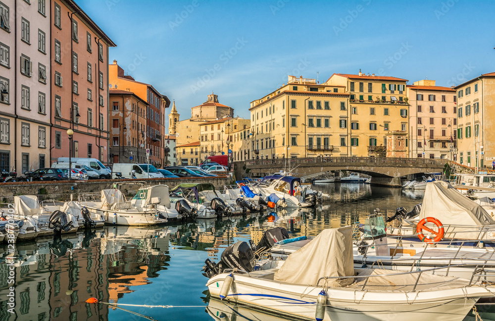 Buildings, canals and boats in the Little Venice district of Livorno, Tuscany, Italy. The Venice quarter is the most charming and picturesque part of the city