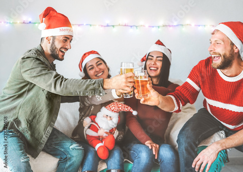 Photography Group of happy friends cheering with beer at christmas party - Young people havi