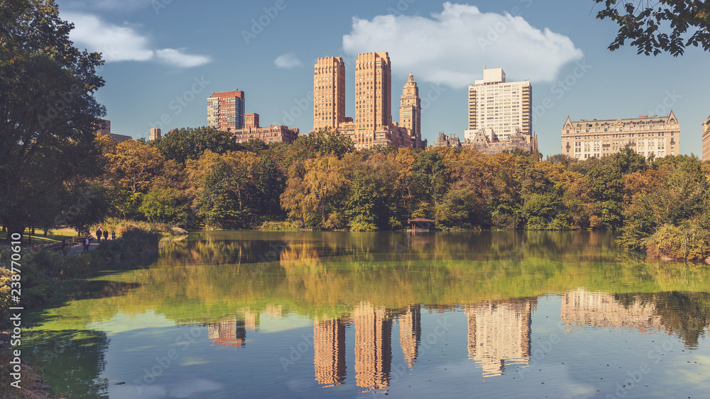 Reflections of famous Upper West Side buildings on the Lake, Central Park, New York City, USA Reflections of famous Upper West Side buildings on the Lake, Central Park, New York City, USA