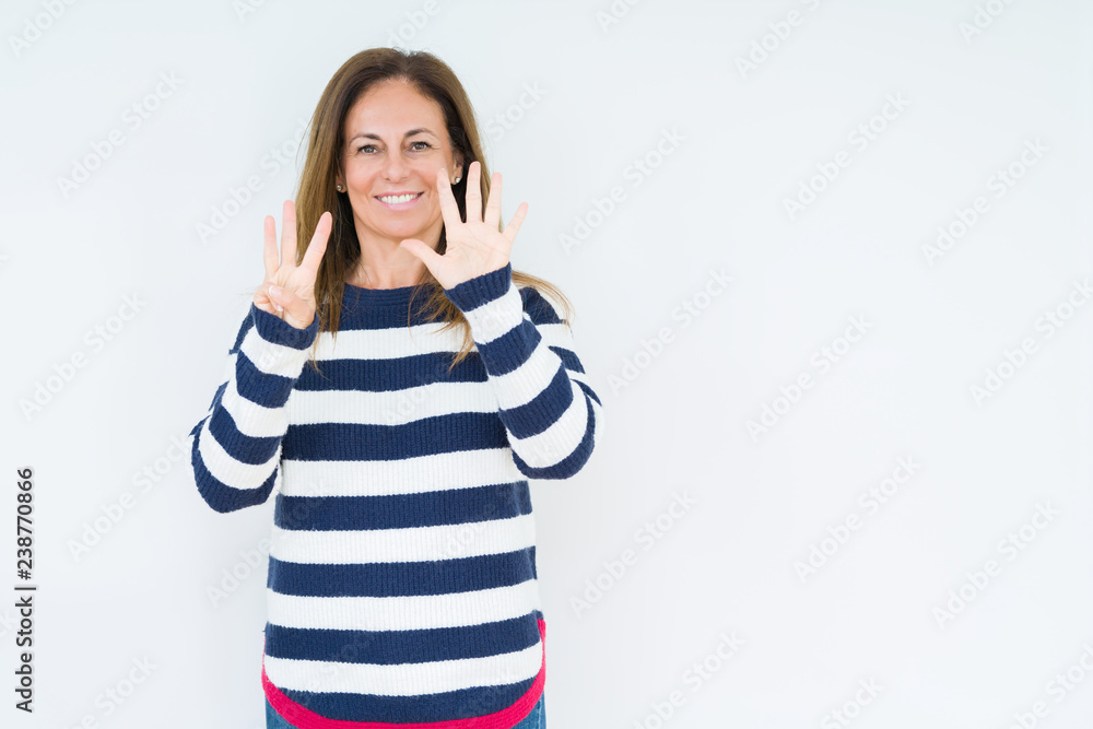 Beautiful middle age woman wearing navy sweater over isolated background showing and pointing up with fingers number eight while smiling confident and happy. Beautiful middle age woman wearing navy sweater over isolated background showing and pointing up with fingers number eight while smiling confident and happy.