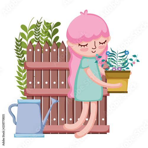 girl lifting houseplant with sprinkler and fence