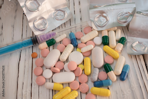 Drug addiction and chemsex illustration with syringe and pills