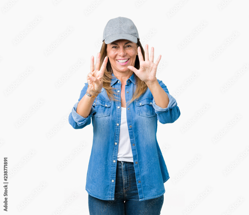 Beautiful middle age woman wearing sport cap over isolated background showing and pointing up with fingers number eight while smiling confident and happy. Beautiful middle age woman wearing sport cap over isolated background showing and pointing up with fingers number eight while smiling confident and happy.