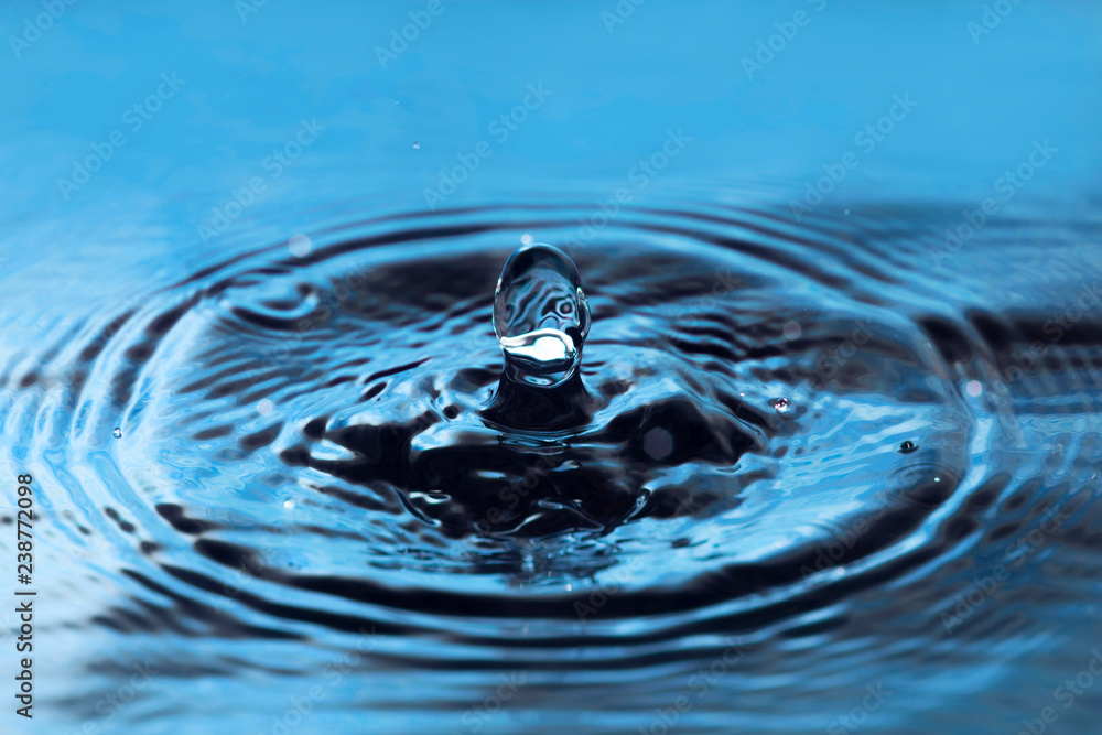 Water drop close up. Blue water splash. Water drop close up. Blue water splash.