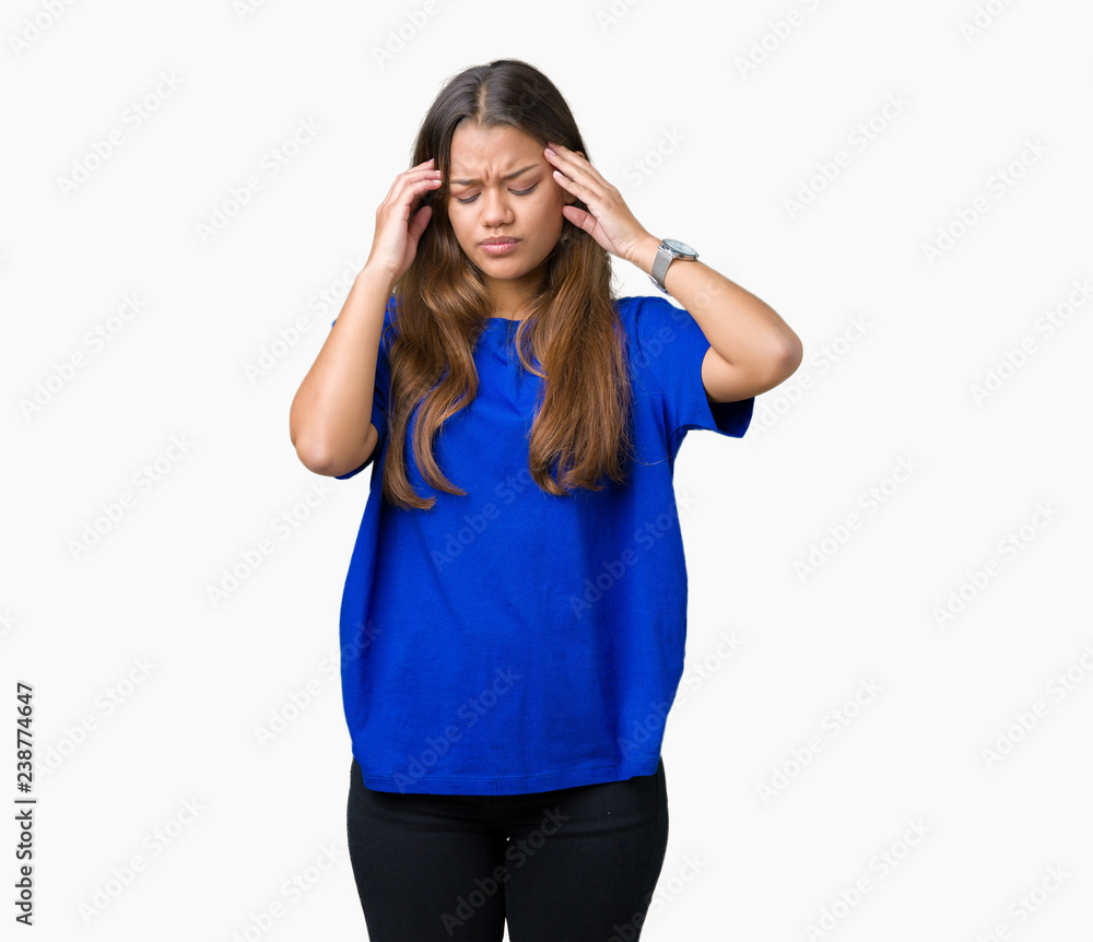 Young beautiful brunette woman wearing blue t-shirt over isolated background covering ears with fingers with annoyed expression for the noise of loud music. Deaf concept. Young beautiful brunette woman wearing blue t-shirt over isolated background covering ears with fingers with annoyed expression for the noise of loud music. Deaf concept.