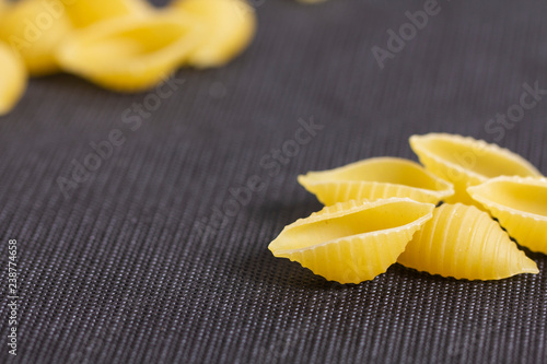pasta on black background. Top view with copy space