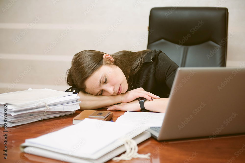 Business woman tired from working with laptop computer. Sleeping and taking nap concept. Business people and workload theme. Business woman tired from working with laptop computer. Sleeping and taking nap concept. Business people and workload theme.
