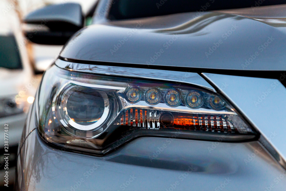 Car's exterior details. Close up detail LED headlights on a modern car.